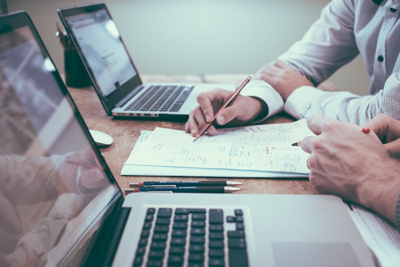 Professional reviewing financial documents on desk